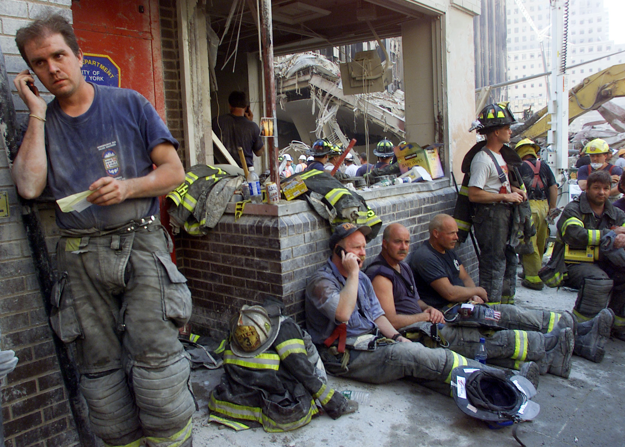 Firemen from around the nation gather at a destroyed firehouse next to the towers as they take a break from rescue efforts in New York September 13, 2001. (Photo: REUTERS/Newscom)