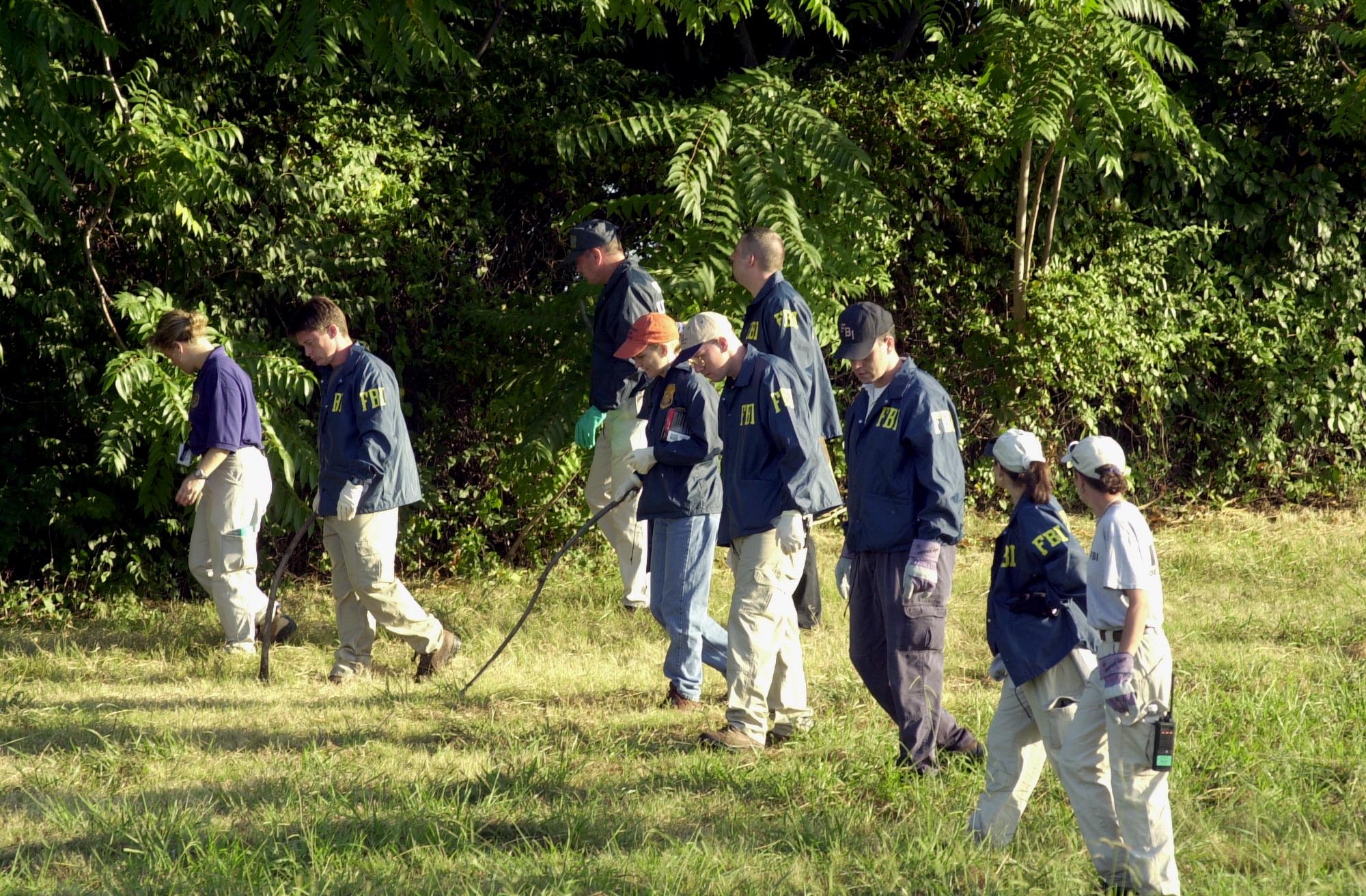 FBI agents search the grounds surrounding the Pentagon on September 12, 2001 in Arlington, Virginia for any evidence related to the attack.(Photo: UPI Photo Service/Michael Kleinfeld/Newscom) 