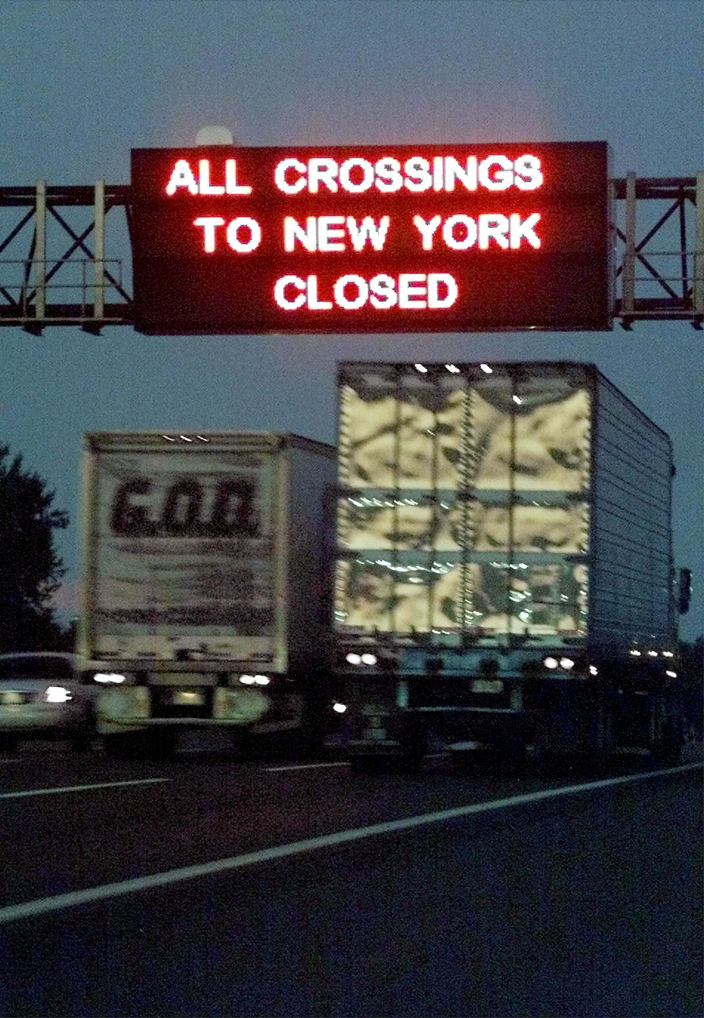 A sign over the New Jersey Turnpike in New Brunswick, New Jersey warns travelers that all bridge and tunnel crossings into New York City have been closed off. (Photo:REUTERS/Jim Bourg/Newscom