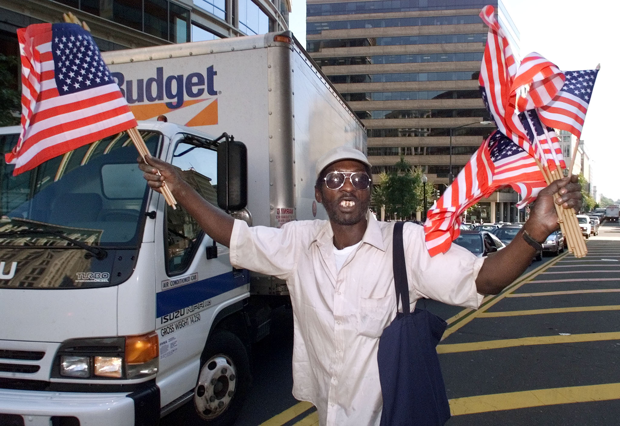 Jeremy Hodgkins hands out American flags to drivers in Washington D.C. September 13, 2001. Immediately after the attack flag sales soared in the United States -- with many stores emptying their inventory. (Photo: REUTERS/Win McNamee/Newscom)