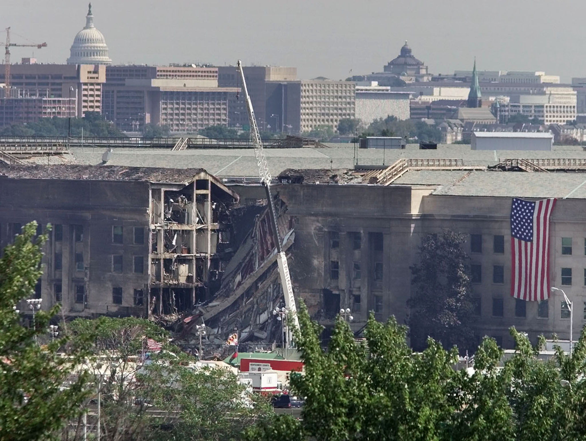 The U.S. Capitol hovers in the background over the damaged area of the Pentagon building, September 13, 2001. (Photo: REUTERS/Larry Downing/ Newscom)
