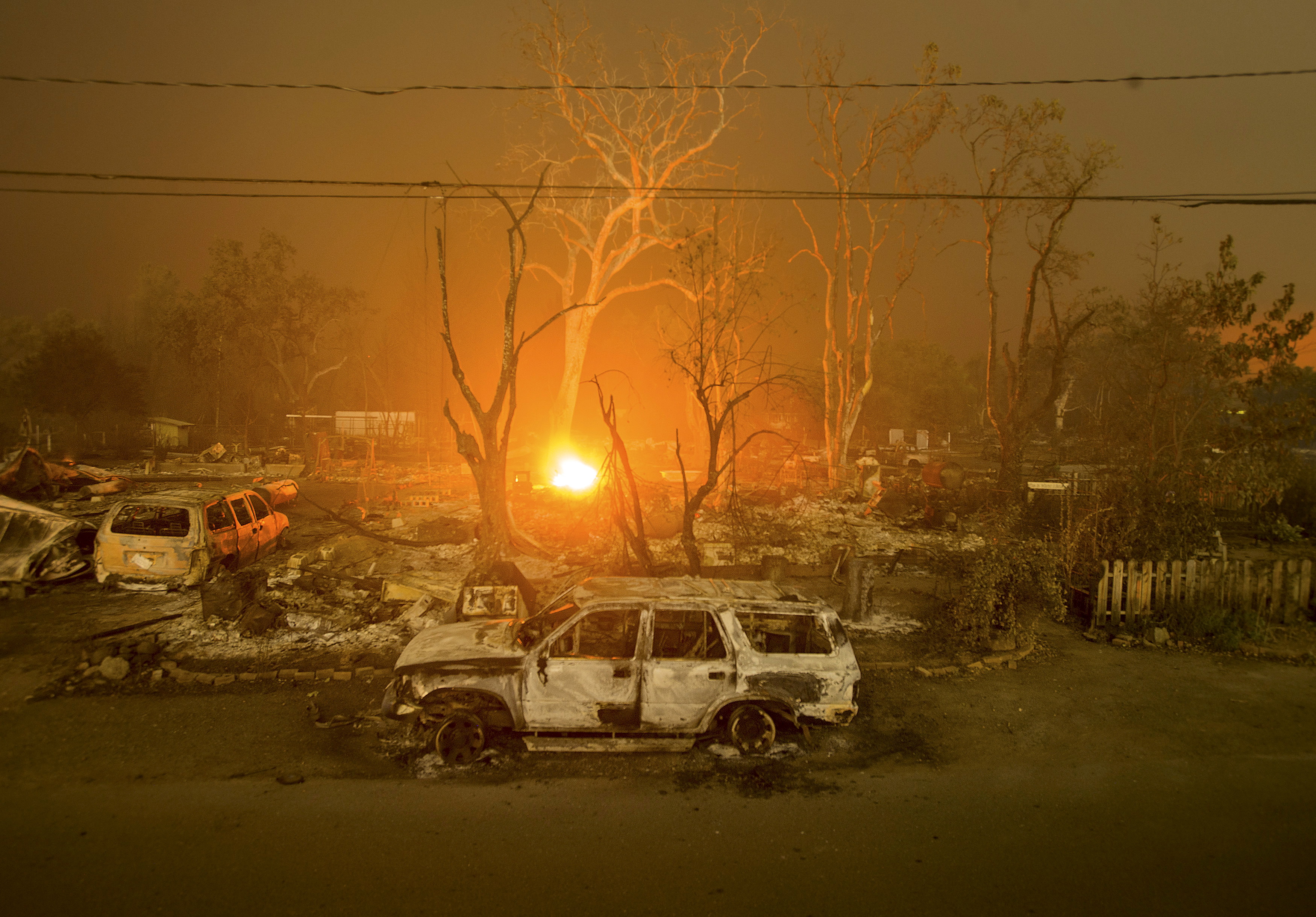 Burned out remains of vehicles and homes scorched by the Valley Fire line Wardlaw St. in Middletown, California September 13, 2015. (Photo: REUTERS/Noah Berger/Newscom)