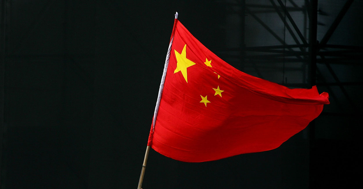 Beijing has set an ambitious goal for China to domestically produce 40% of the country’s demand for semiconductors by next year and 70% by 2025, up from less than 20% now. Pictured: A Chinese teenager waves a national flag during a festival to mark Chinese National Day on Oct. 2, 2005 in Beijing, China. (Photo: Guang Niu/Getty Images)