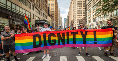 LGBT activist march "DIGNITY" on rainbow flag