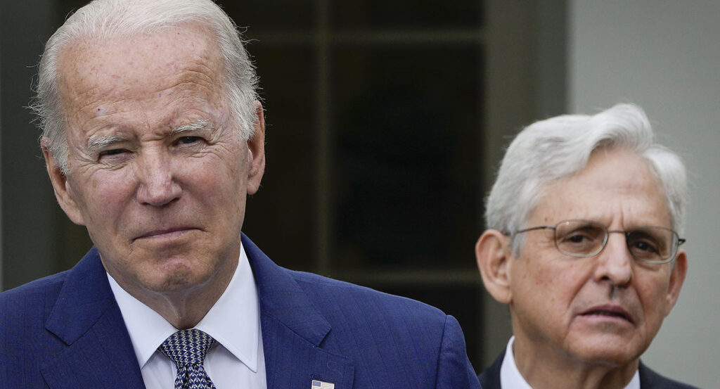 Joe Biden scowls and Merrick Garland looks suspicious