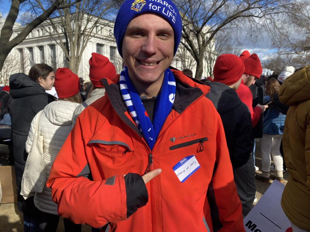 man wears March for Life hat at the March for Life
