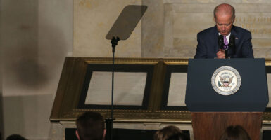 Joe Biden speaks in a suit