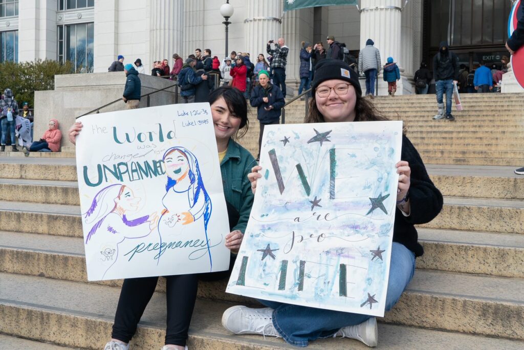 Kids hold signs March for Life