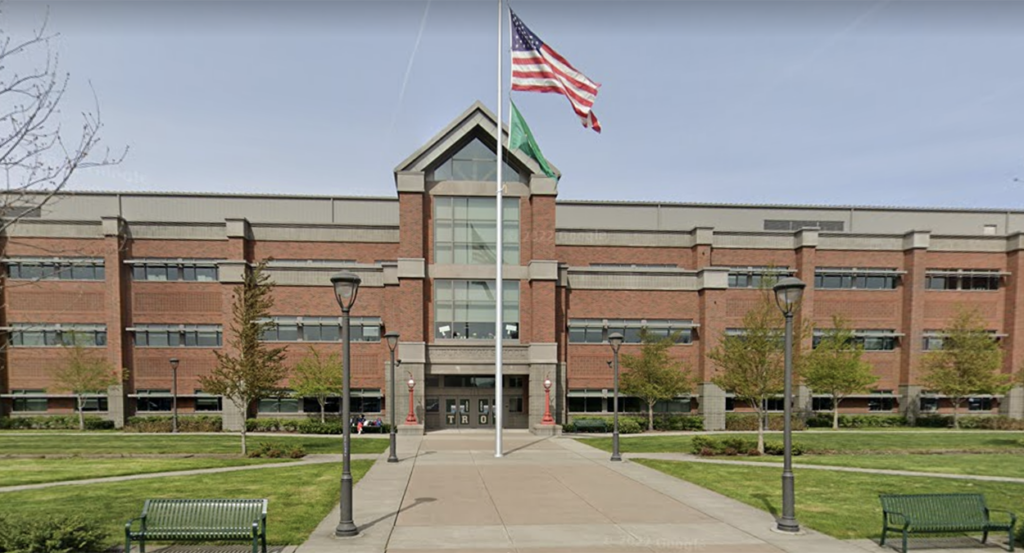 Auburn High School in Auburn, Washington, with an American flag out front