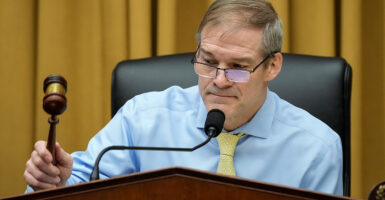 Jim Jordan in a blue shirt with a yellow tie