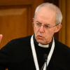 Justin Welby in a black priest's robe with a white collar