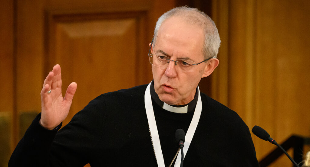 Justin Welby in a black priest's robe with a white collar