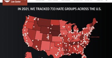 Red map of the United States with SPLC "hate groups" plotted on it