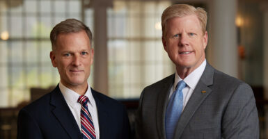 Dondi Costin and Jonathan Falwell in suits