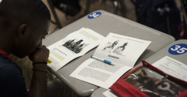 Student looks over his notes during an Advanced Placement African American Studies course