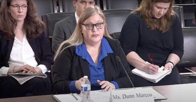 “I have always promised to hold the powerful to account regardless of political party,” Porter told Robin Dunn Marcos, director of the Office of Refugee Resettlement under the Department of Health and Human Services sits before members of Congress wearing a blue top and black blazer.