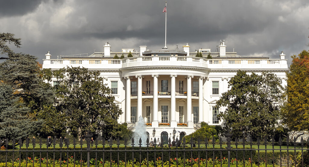 Ominous-looking White House with storm clouds above
