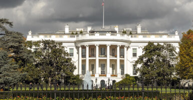 Ominous-looking White House with storm clouds above