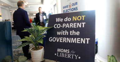 Moms for Liberty sign says we don't co-parent with the government