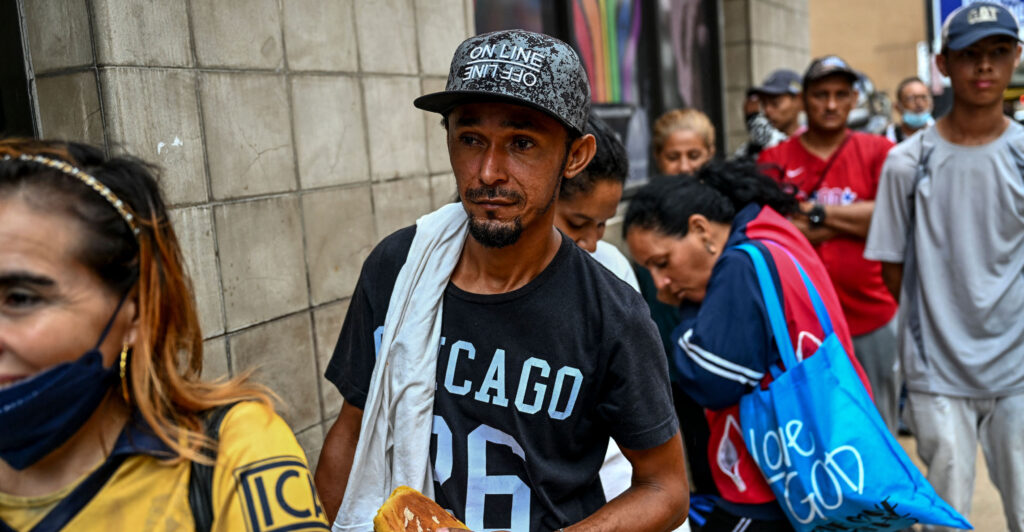 Illegal Immigrant waits in line at shelter.