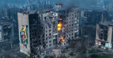 Blames shoot out of what appears to be a bombed apartment building in Bakhmut, Ukraine.