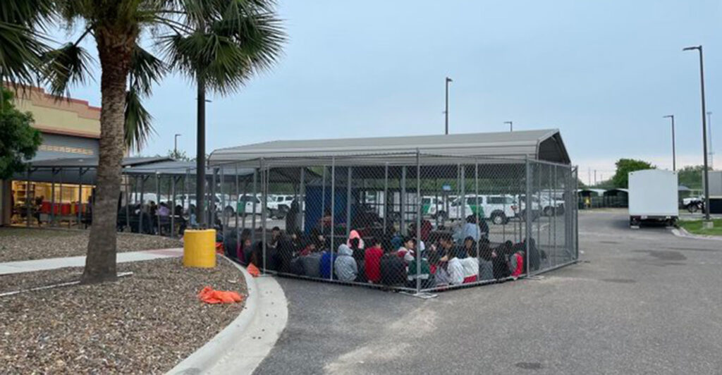 A large group of illegal migrant minors are seen in a cage like holding facility in Texas.