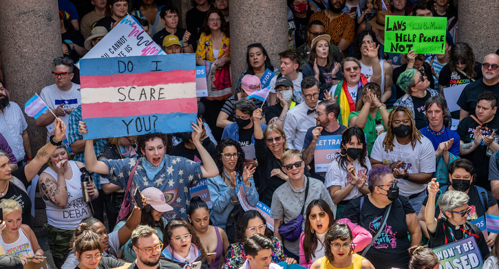 Transgender protest Austin Texas sign reads "Do I scare you?"