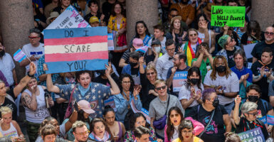 Transgender protest Austin Texas sign reads 