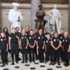 The Rushingbrook Children's Choir in suits and dresses in Statuary Hall