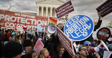 Pro-life and abortion activists protest in front of the U.S. Supreme Court