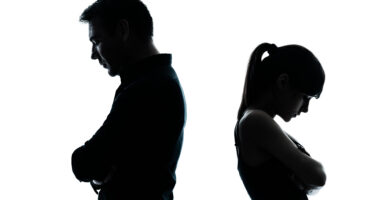 one man and teenager girl dispute conflict in silhouette indoors on white background
