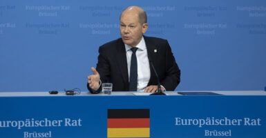 German Chancellor Olaf Scholz talks to the media at a press conference