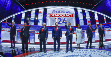 Eight GOP presidential candidates stand on the debate stage.