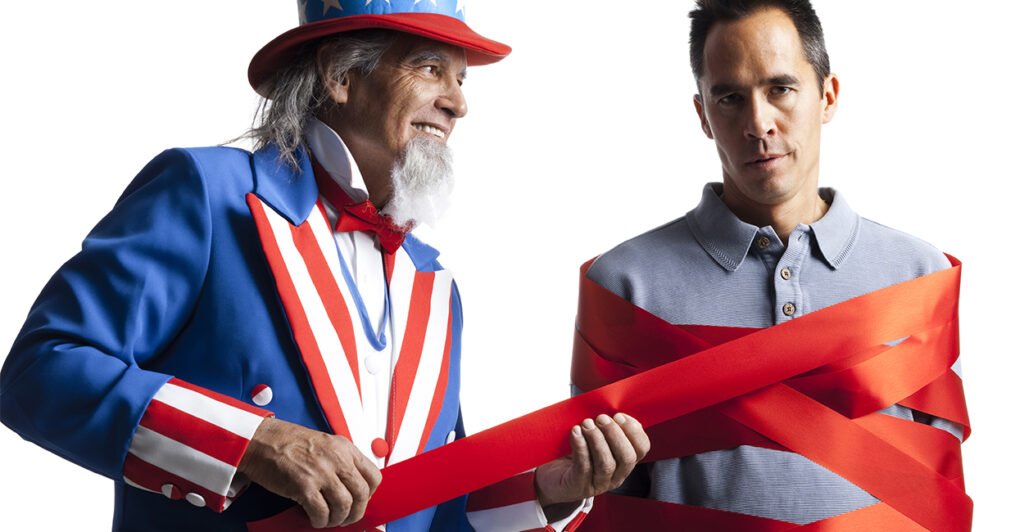 Uncle Sam figure wrapping a citizen in red tape.