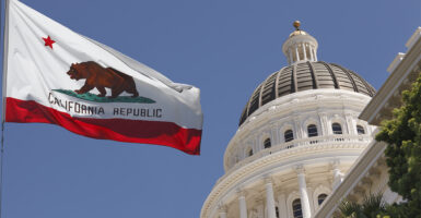 Dome of California State Capitol and state flag