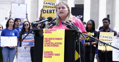 Student Loan protestors at a rally Demand President Biden Cancel Student Debt