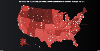 A map of the United States in red with SPLC-accused "hate groups" in white