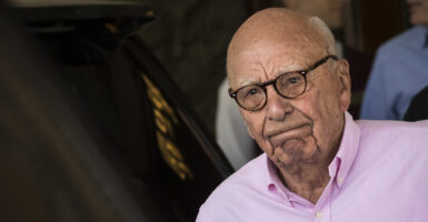 Rupert Murdoch in a pink button down shirt