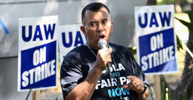 A local UAW president speaks on a picket line
