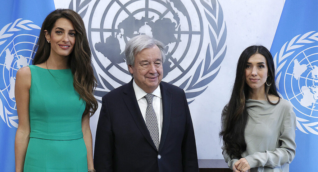 United Nations Secretary-General Antonio Guterres, in a suit, meets with Amal Clooney and Nadia Murad