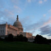 A blue sky is seen behind the U.S. Capitol Building.