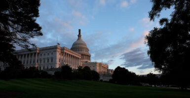 A blue sky is seen behind the U.S. Capitol Building.