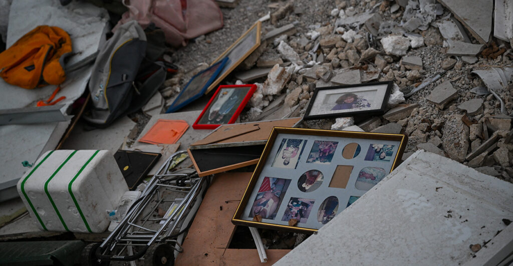 Family photos are seen in the rubble of a home bombed by Hamas in Israel.