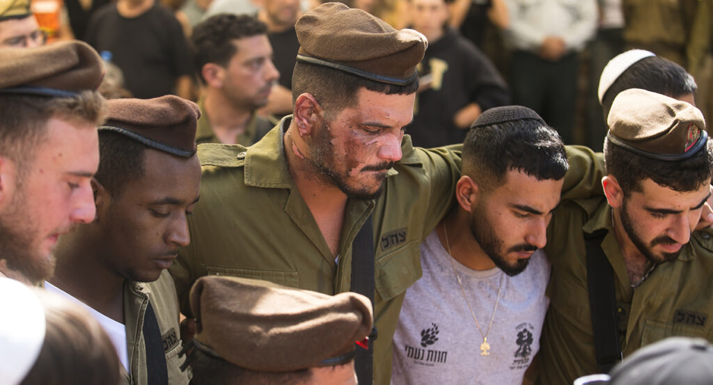 Israeli soldiers mourn the loss of an IDF comrade