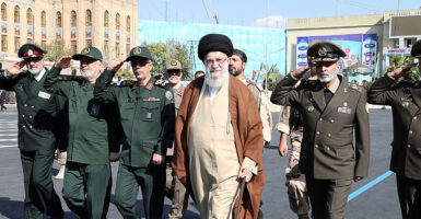Ayatollah Khamenei marches in the street with military leaders