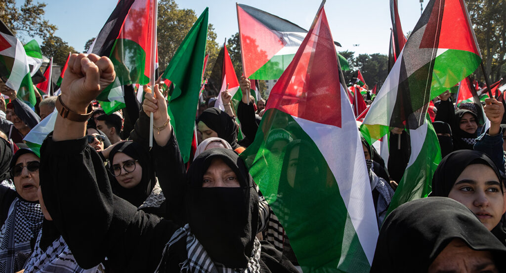 Muslims holding Palestinian flags march in Istanbul, Turkey