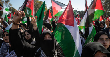 Muslims holding Palestinian flags march in Istanbul, Turkey