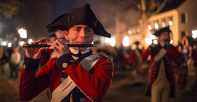 the night torch light parade with the fife and drum corps in Colonial Williamsburg