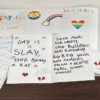 LGBTQ-themed letters reading "gay is slay"