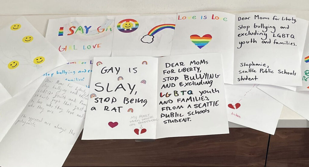 LGBTQ-themed letters reading "gay is slay"